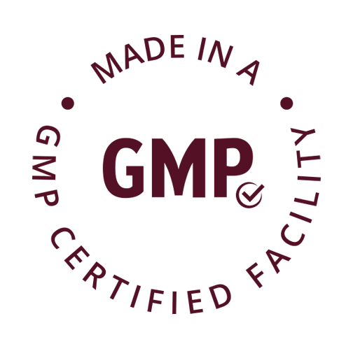 A manufacturing quality badge on a beige background featuring a circular emblem with 'GMP' prominently displayed. The text 'MADE IN A GMP CERTIFIED FACILITY' curves around the circle. Below the emblem, the text 'made in a certified gmp lab' appears in an italic font.