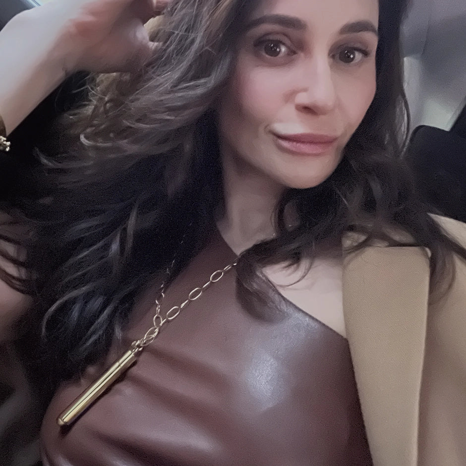Cofounder Meghan Carozza wearing her own design - 24k overnighter pendant and chain by Mabel Chong for elevated UTI prevention and women's sexual wellness