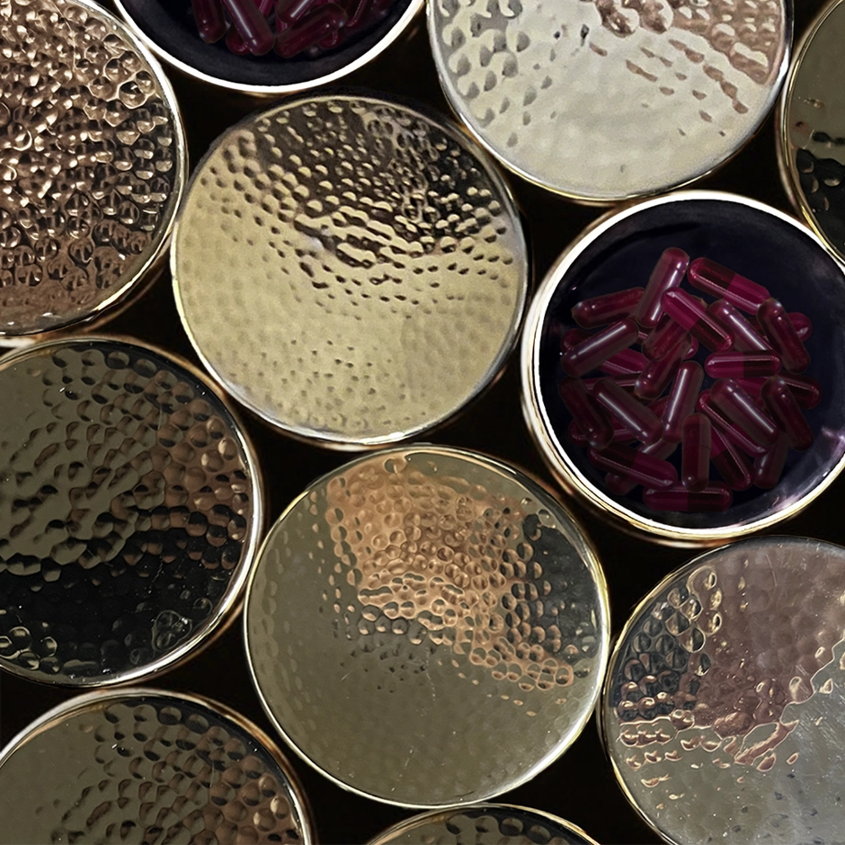 Luxurious brass-clad stainless steel canister designed by Meghan Carozza for sustainable Good Kitty UTI prevention supplements storage.