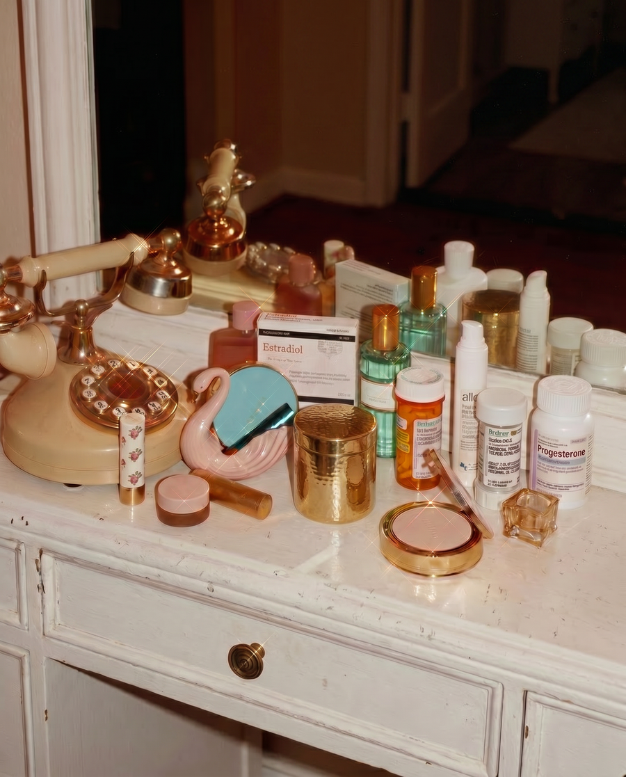 Cosmetic products on a vanity with a mirror and various items.