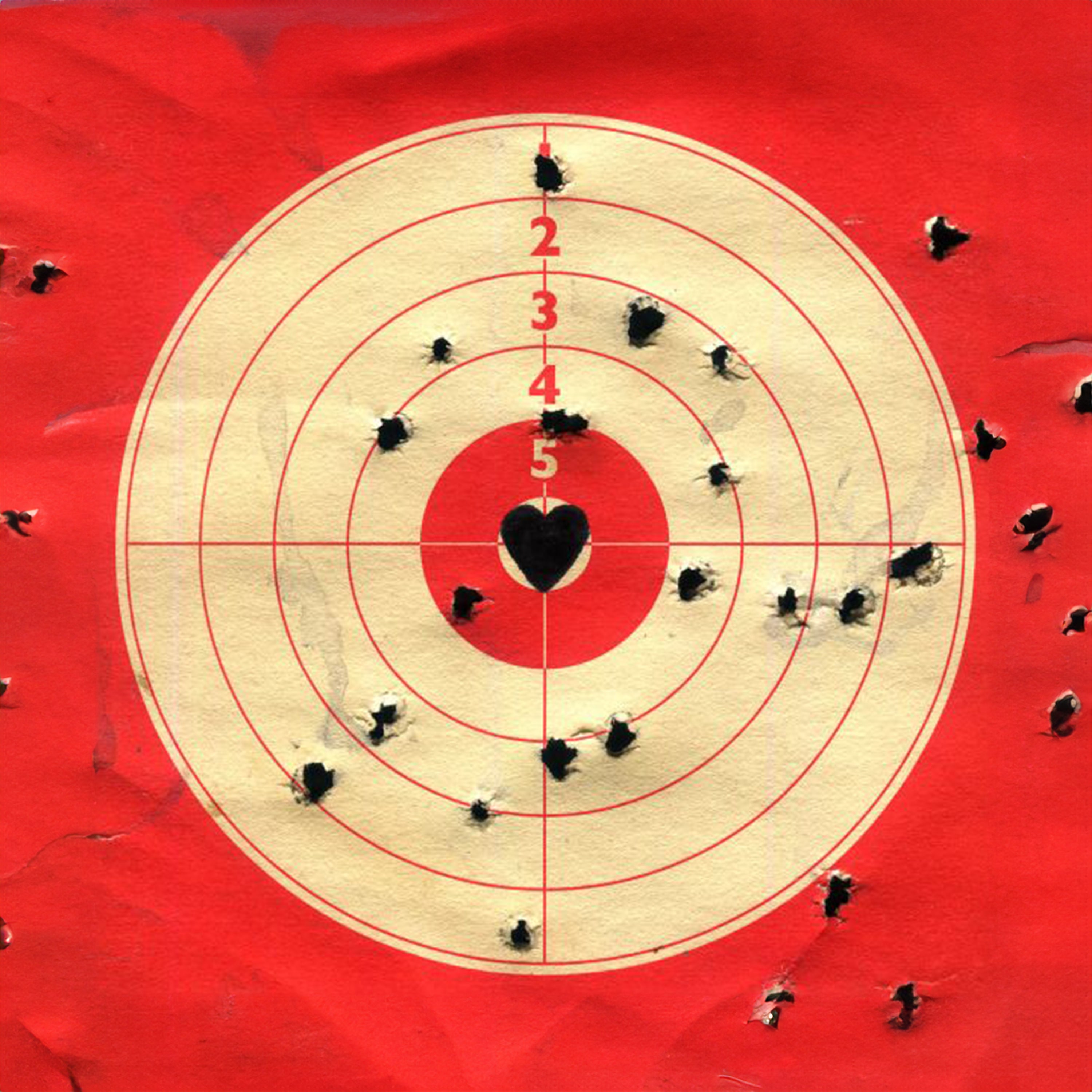 Target with heart in center on a red background