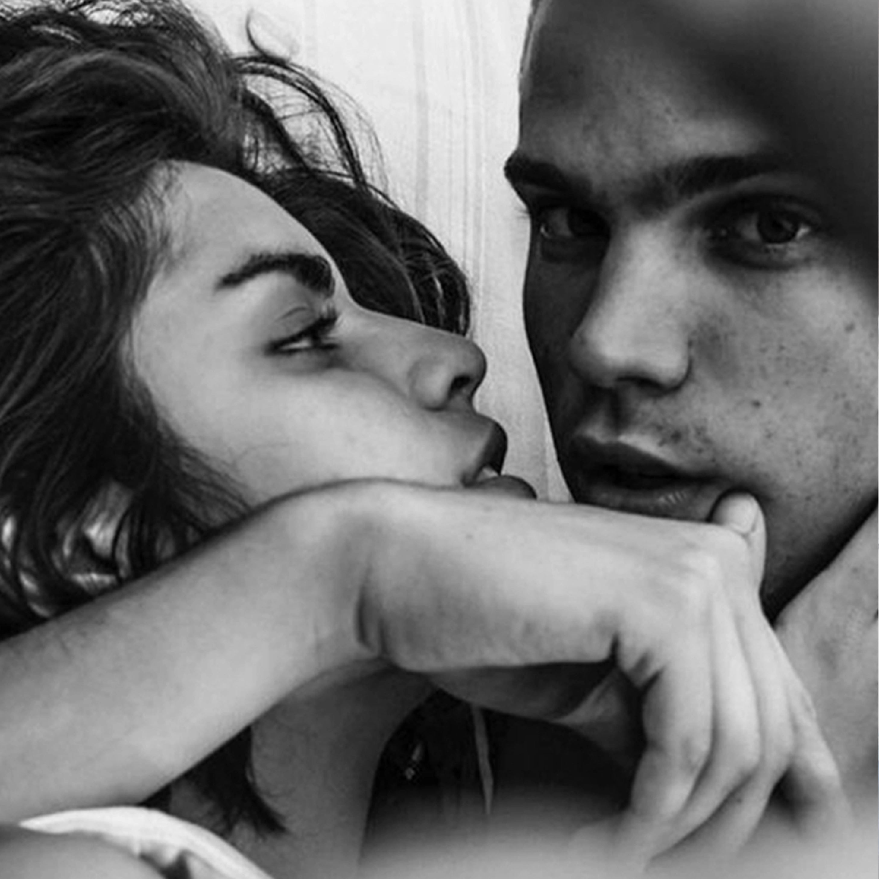 Split image : Black and white close-up of two people's faces in an intimate moment. Menu top left. The GOOD KITTY logo appears at the top of the image.