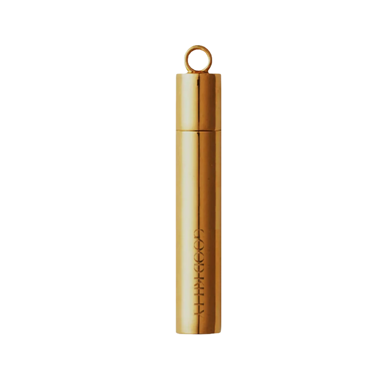 Gold Good Kitty pill stash pendant designed to hold capsules on a keychain or necklace.