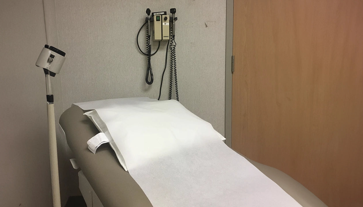 Medical examination table with equipment in a clinical setting