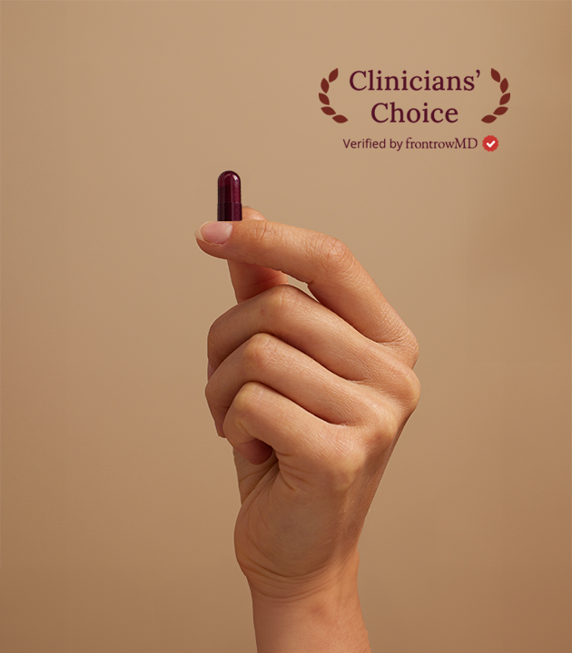 Hand holding a small object against a beige background with 'Clinicians' Choice' text.